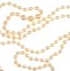 LONG STRING OF GRADUATED CULTURED PEARLS WITH A 9 CT GOLD CLASP MOUNTED WITH A GARNET at Ross's Online Art Auctions