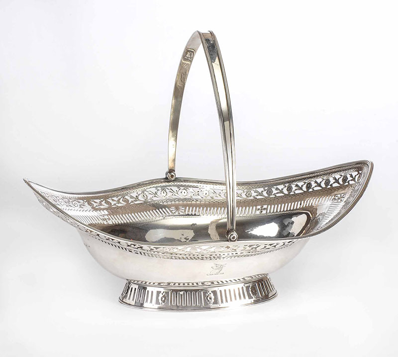 Oval Pierced and Engraved Silver Cake Basket with a Swing Handle on a Pierced Oval Foot at Ross's Online Art Auctions