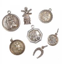 A SELECTION OF SILVER ST. CHRISTOPHER MEDALS AND SILVER CHARMS at Ross's Online Art Auctions