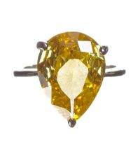 WHITE METAL AND YELLOW STONE RING at Ross's Online Art Auctions