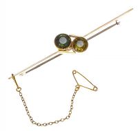 15CT ROSE GOLD AND PERIDOT BAR BROOCH at Ross's Online Art Auctions