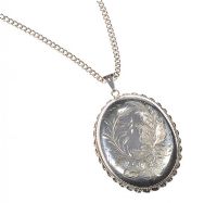 STERLING SILVER ENGRAVED LOCKET ON A STERLING SILVER CURB LINK CHAIN at Ross's Online Art Auctions