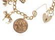 18CT GOLD CHARM BRACELET WITH 9CT GOLD AND 18CT GOLD CHARMS at Ross's Online Art Auctions
