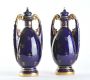 PAIR OF ROYAL VIENNA TWO HANDLED VASES WITH LIDS & OVAL PAINTED PANELS at Ross's Online Art Auctions