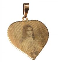 GOLD-TONE METAL HEART-SHAPED PENDANT IN A RELIGIOUS THEME at Ross's Online Art Auctions