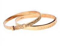 TWO GOLD ENGRAVED CHRISTENING BANGLES at Ross's Online Art Auctions