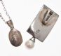STERLING SILVER LOCKET AND CHAIN, AND A STERLING SILVER PENDANT SET WITH A CULTURED PEARL at Ross's Online Art Auctions