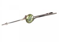 PLATINUM BAR BROOCH SET WITH PERIDOT at Ross's Online Art Auctions
