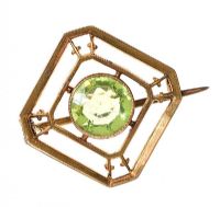 GOLD-TONE METAL BROOCH WITH GREEN CRYSTAL at Ross's Online Art Auctions