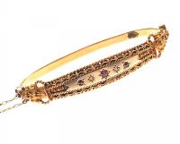 9CT GOLD ANTIQUE EDWARDIAN DIAMOND AND GARNET BANGLE at Ross's Online Art Auctions