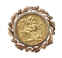 9CT GOLD MOUNTED FULL SOVEREIGN BROOCH at Ross's Online Art Auctions