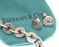 TIFFANY & CO. LINK BRACELET, EARRINGS AND POUCH at Ross's Online Art Auctions