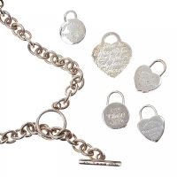 TIFFANY & CO. STERLING SILVER NECKLACE WITH FIVE CHARMS at Ross's Online Art Auctions
