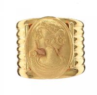 YELLOW METAL RING WITH EMBOSSED CAMEO at Ross's Online Art Auctions