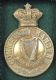 MILITARY BRASS BADGE at Ross's Online Art Auctions