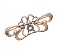 ART NOUVEAU 9CT ROSE GOLD BROOCH SET WITH AMETHYST at Ross's Online Art Auctions