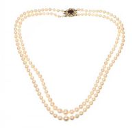 GRADUATED DOUBLE STRING OF PEARLS WITH A 9CT GOLD GARNET CLASP at Ross's Online Art Auctions