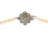 GRADUATED STRAND OF CULTURED PEARLS WITH SILVER AND MARCASITE DAISY CLASP at Ross's Online Art Auctions