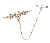 VICTORIAN 9CT GOLD SEED PEARL HORSESHOE BROOCH WITH FITTED BOX at Ross's Online Art Auctions