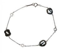 TIFFANY & CO. PLATINUM PEARL AND DIAMOND BRACELET at Ross's Online Art Auctions