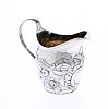 EMBOSSED SILVER CREAM JUG at Ross's Online Art Auctions